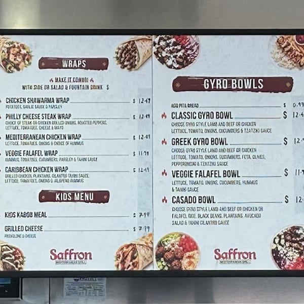 Digital Saffron menu board displays Mediterranean gyros, wraps, bowls, kids meals, and kabob plates with food photos.